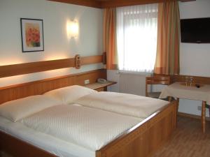 Letto o letti in una camera di Pension Riedlsperger