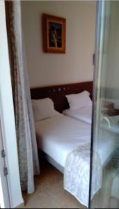 
A bed or beds in a room at TAGHIT SAOURA
