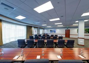 a conference room with a long table and chairs at The Hotel Concord in Concord