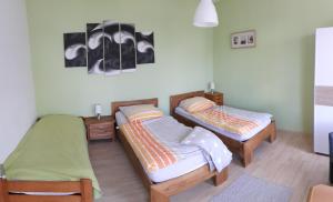 Кровать или кровати в номере Gästehaus UP-Arnold