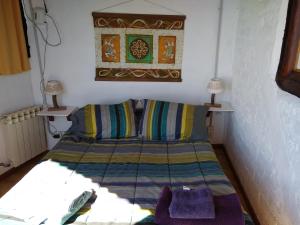 Ένα ή περισσότερα κρεβάτια σε δωμάτιο στο Murmullos del Lago