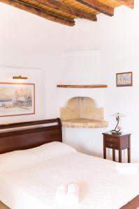A bed or beds in a room at Akrotiri
