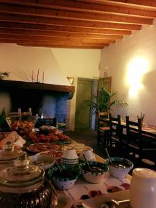 a table with plates of food on top of it at Podere Scaluccia in Impruneta