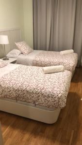 A bed or beds in a room at Apartamentos Aguas Limpias