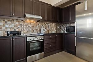 A kitchen or kitchenette at Lux Sea View Apartment Még 7 kép