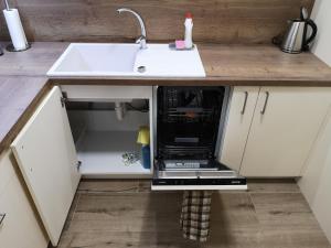 Kuchyňa alebo kuchynka v ubytovaní Romantic Chopok Juh Apartment 22