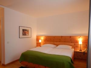 Giường trong phòng chung tại Landhaus Kügler-Eppich