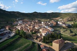 an aerial view of a village in the mountains at Alojamientos rurales Angelita in Olocau del Rey