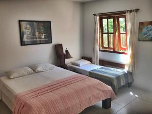 Postel nebo postele na pokoji v ubytování Village Mata Encantada
