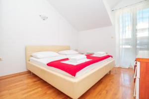 Postel nebo postele na pokoji v ubytování Mediterranean Blue Apartments