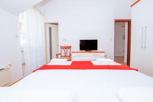 Postel nebo postele na pokoji v ubytování Mediterranean Blue Apartments