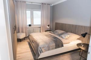 Кровать или кровати в номере Quartier 23