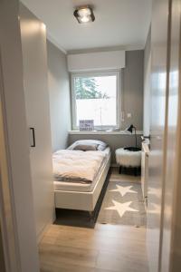 Tempat tidur dalam kamar di Quartier 23