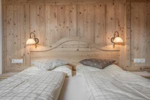 Postel nebo postele na pokoji v ubytování B&B Ciastel