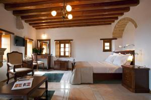 A bed or beds in a room at Likinia Hotel