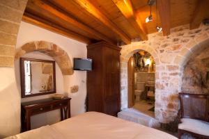 A bed or beds in a room at Likinia Hotel