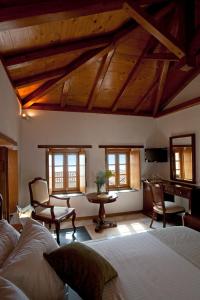 A bed or beds in a room at Likinia Hotel