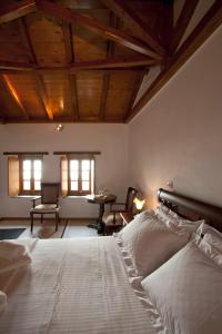 A bed or beds in a room at Likinia Hotel