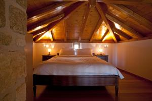A bed or beds in a room at Likinia Hotel