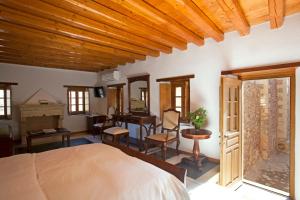 A bed or beds in a room at Likinia Hotel