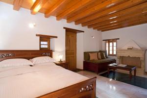 A bed or beds in a room at Likinia Hotel