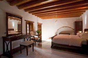 A bed or beds in a room at Likinia Hotel