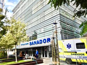 a sambord truck parked in front of a building at Downtown Victoria Apartments By CityBookings in Bucharest