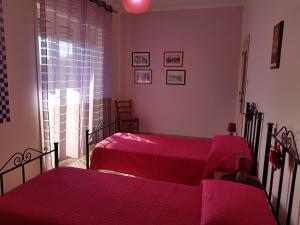 Posteľ alebo postele v izbe v ubytovaní La Casa del Sole