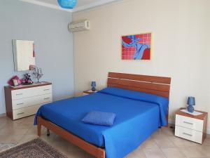 Posteľ alebo postele v izbe v ubytovaní La Casa del Sole