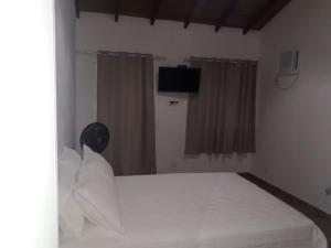 Postel nebo postele na pokoji v ubytování som das aguas paraty