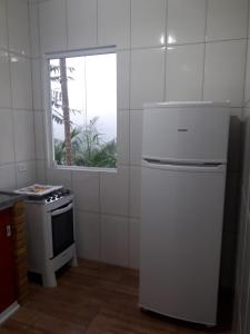 Kuchyň nebo kuchyňský kout v ubytování som das aguas paraty