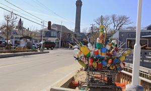a tree filled with lots of flowers on top of a pole at Anchor Inn Beach House in Provincetown