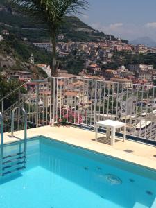 a swimming pool with a view of a city at Hotel Voce del Mare in Vietri sul Mare