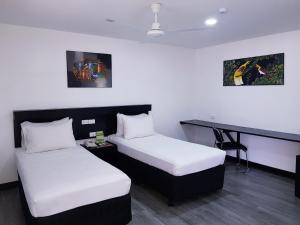 Cama o camas de una habitación en The Shady Rest Hotel