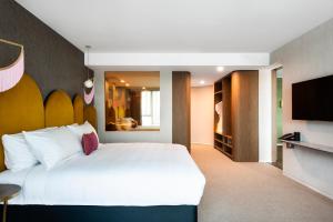 A bed or beds in a room at Ovolo The Valley Brisbane
