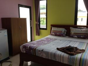 Letto o letti in una camera di Baan Mulan