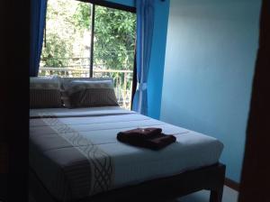 Letto o letti in una camera di Baan Mulan