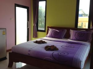 Letto o letti in una camera di Baan Mulan