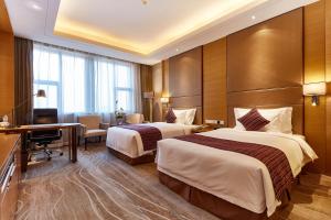 Letto o letti in una camera di Wyndham Jingzhou