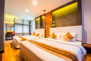 Giường trong phòng chung tại Chawlay Resort Koh Lipe
