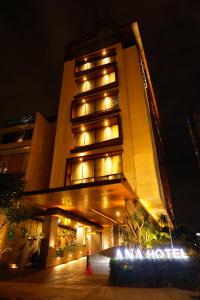 a building with lights in front of it at night at Ana Hotel Jakarta in Jakarta