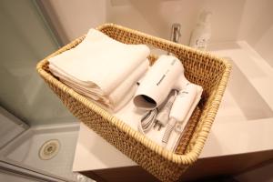 a wicker basket with items in a bathroom at T-home in Tokyo +174 photos