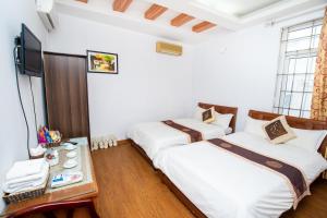 Voodi või voodid majutusasutuse Phuong Dong hotel toas