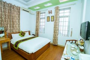 Voodi või voodid majutusasutuse Phuong Dong hotel toas