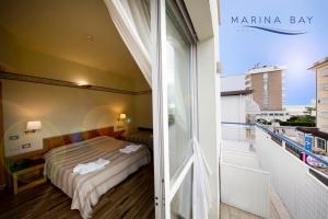 Postel nebo postele na pokoji v ubytování Hotel Marina Bay