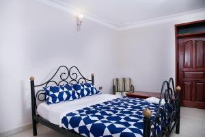 Postel nebo postele na pokoji v ubytování Red Sox Hotel Ltd
