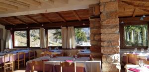 A restaurant or other place to eat at Albergo Ristorante Leso