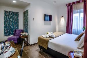 Ліжко або ліжка в номері Navona Colors Hotel