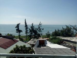 a view of the ocean from the roofs of houses at Minh Duc Guesthouse in Phan Thiet +31 photos