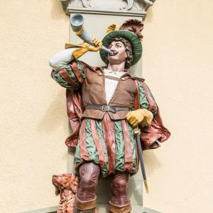 a statue of a man standing on a wall at Hotel Waldhorn in Bern